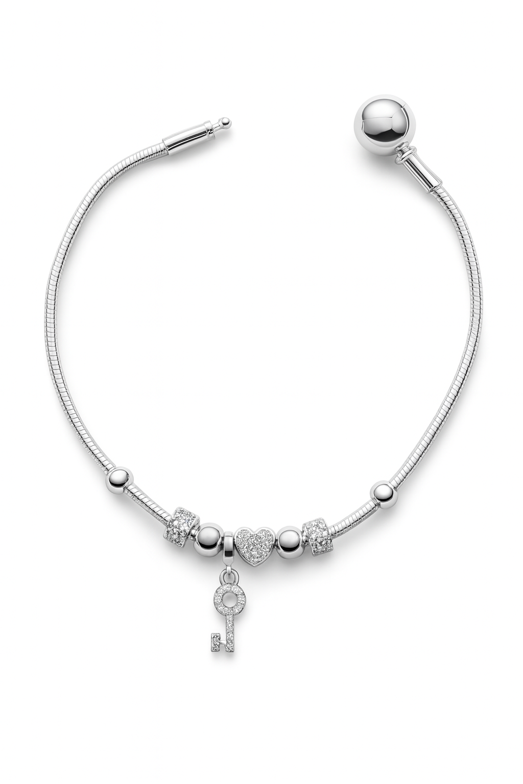 Pulsera con dijes de corazón y llave con zirconia